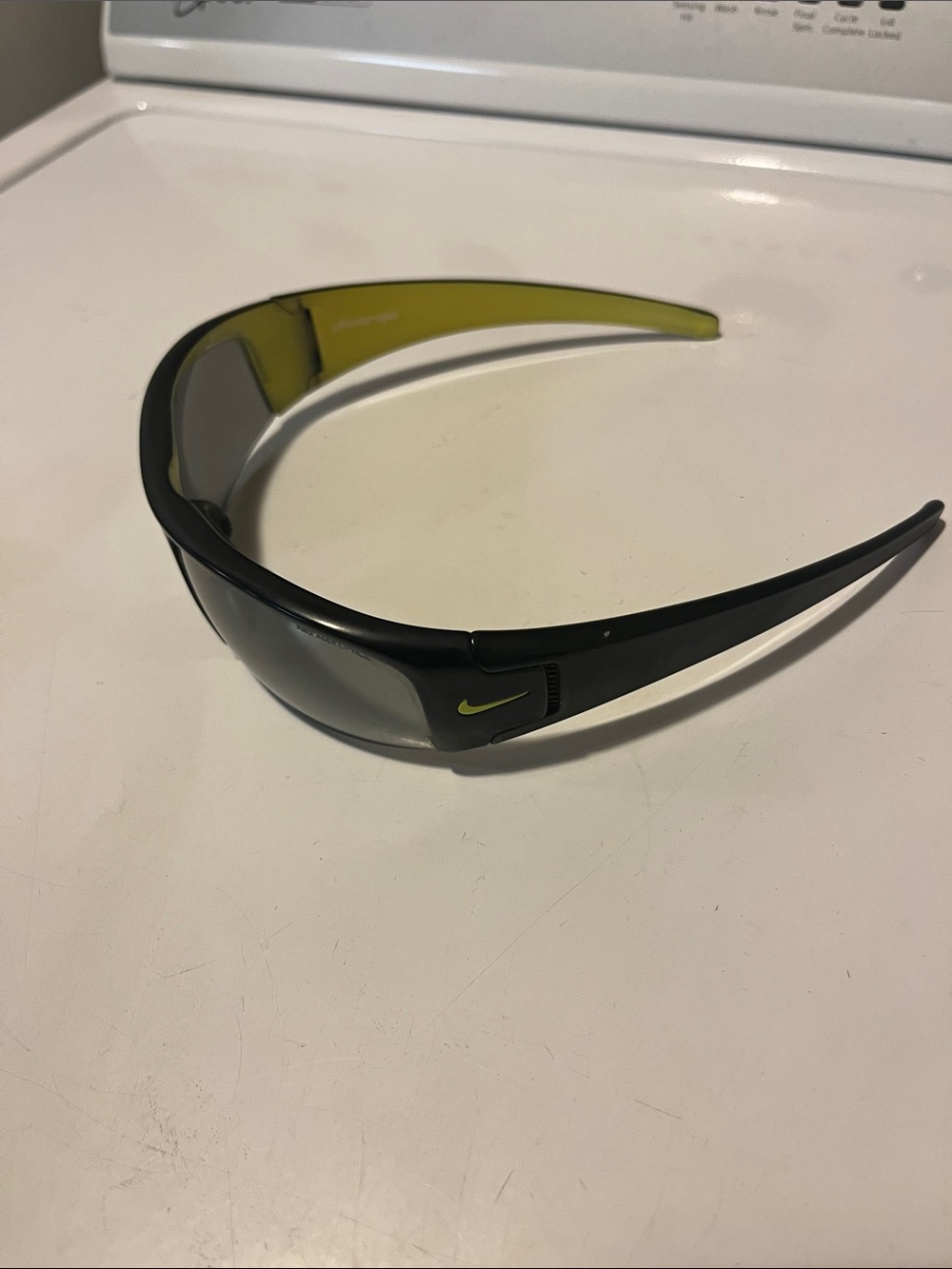 These are Nike Diverge sunglasses in Matte Black with a lime green interior